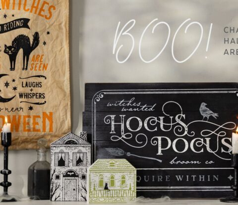 Styled mantle showing several finished halloween projects and text stating Chalk Couture Halloween designs are here.